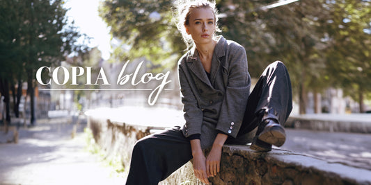 Copia Vintage Blog image of a model sitting on a wall